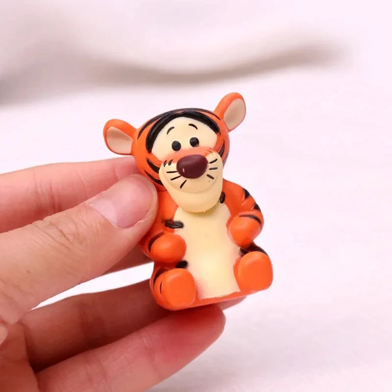 honey bear figure set tiger figure close up in hand