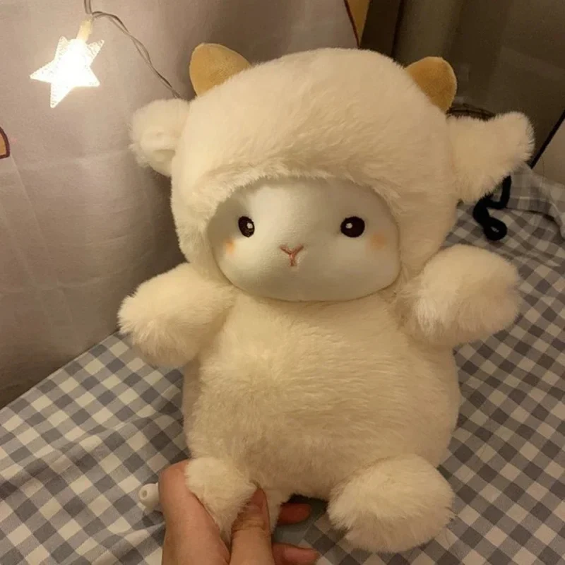 kawaii sheep plush doll on blanket